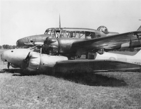 Two_Avro_Ansons_(L9162_and_N4876)__piggyback__in_a_paddock_near_Brocklesby_1.jpg